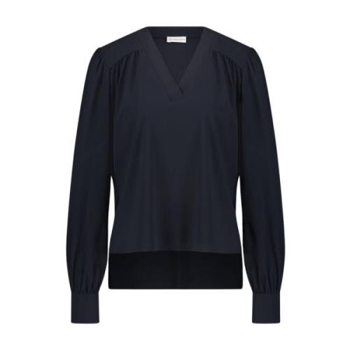 Jane Lushka Elegant Blus i Teknisk Jersey | Blå med Lekfullt Mönster B...