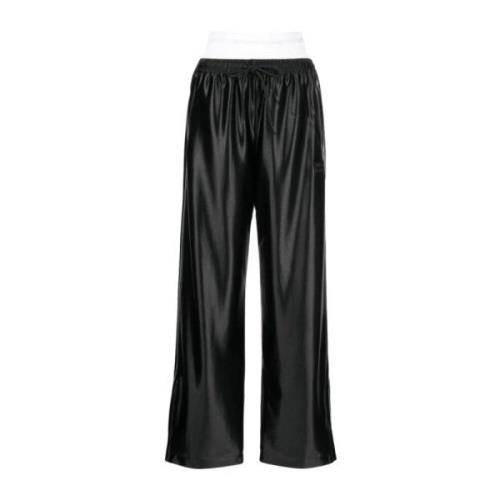 Alexander Wang Svarta track pants med integrerad trosa och staplad Wan...