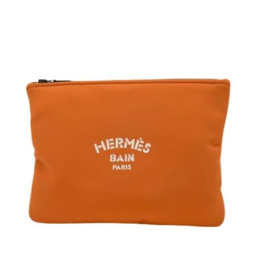 Hermès Vintage Pre-owned Tyg kuvertvskor Orange, Herr